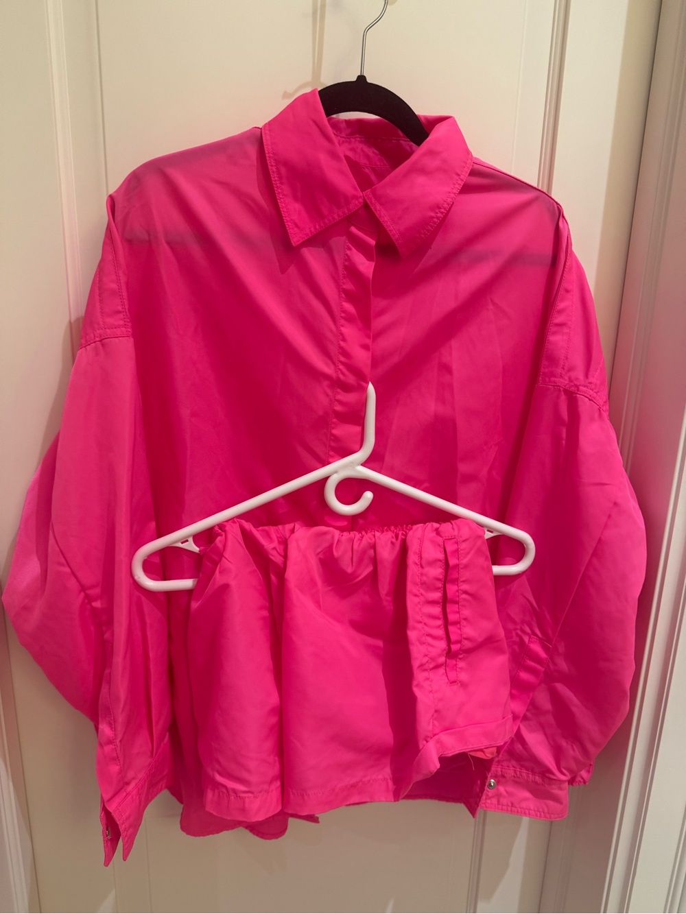 The Frankie Shop Bright Pink matching set shorts and Button-Down Shirt.